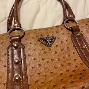 Brown ostrich leather purse; with prada logo